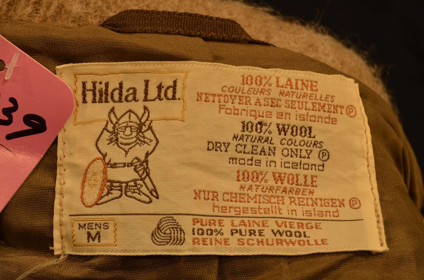 Label on Men's Retro Icelandic Wool Jacket by Hilda Ltd showing 100% wool, made in Iceland, size M, dry clean only