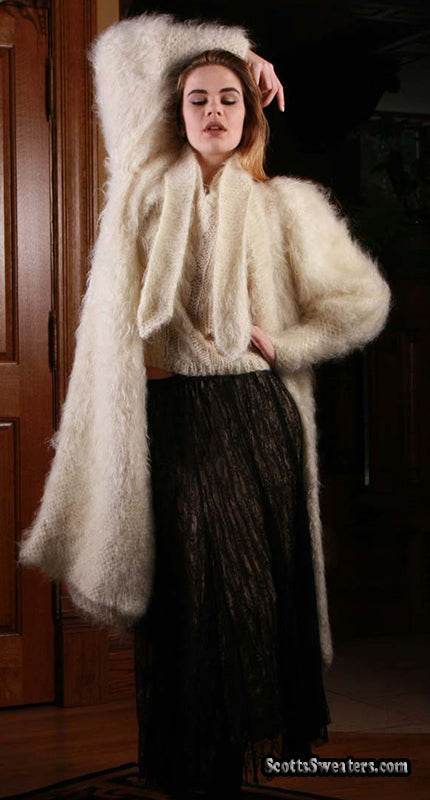 Woman wearing ivory full-length mohair sweater-coat by Arundell in the UK