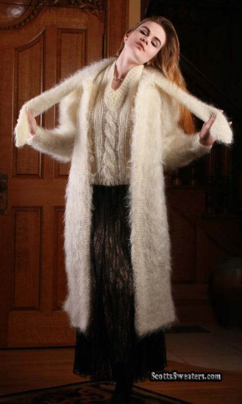 Woman wearing ivory full-length mohair sweater-coat by Arundell UK with open arms