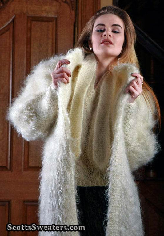 Woman wearing ivory full-length mohair sweater-coat by Arundell in the UK