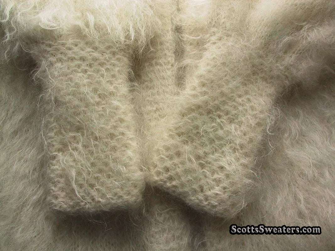 Ivory mohair knit fabric texture of woman’s full-length sweater-coat by Arundell UK