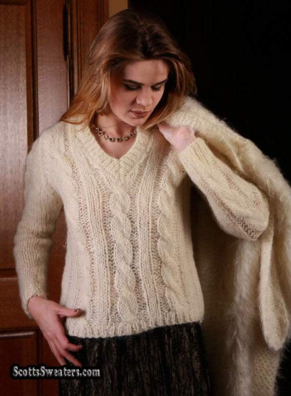 Woman's ivory cable-knit V-neck Italian mohair-wool sweater on model