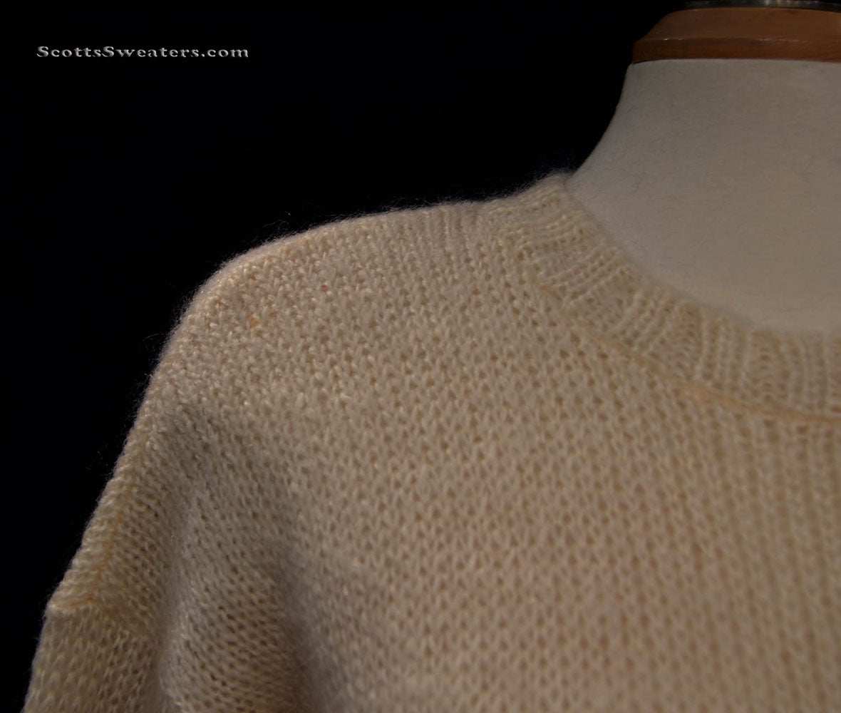 Woman's ivory mohair wool crewneck long sleeve sweater on mannequin
