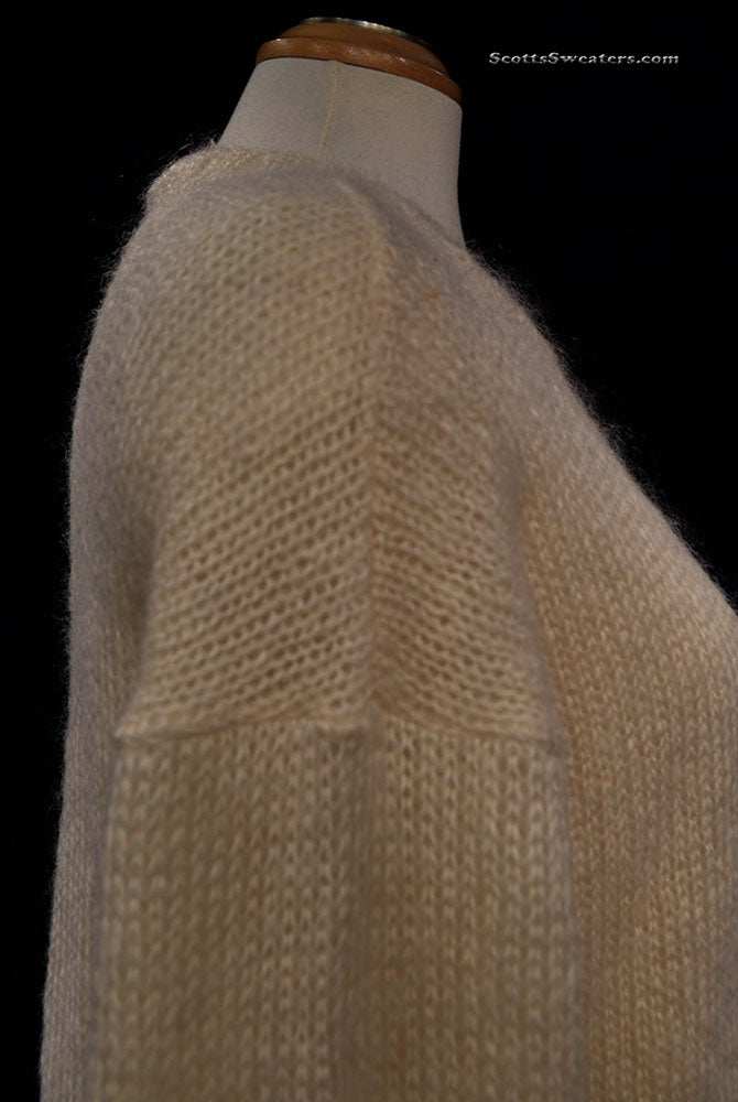 Woman's ivory crewneck mohair and wool long sleeve sweater on mannequin side view
