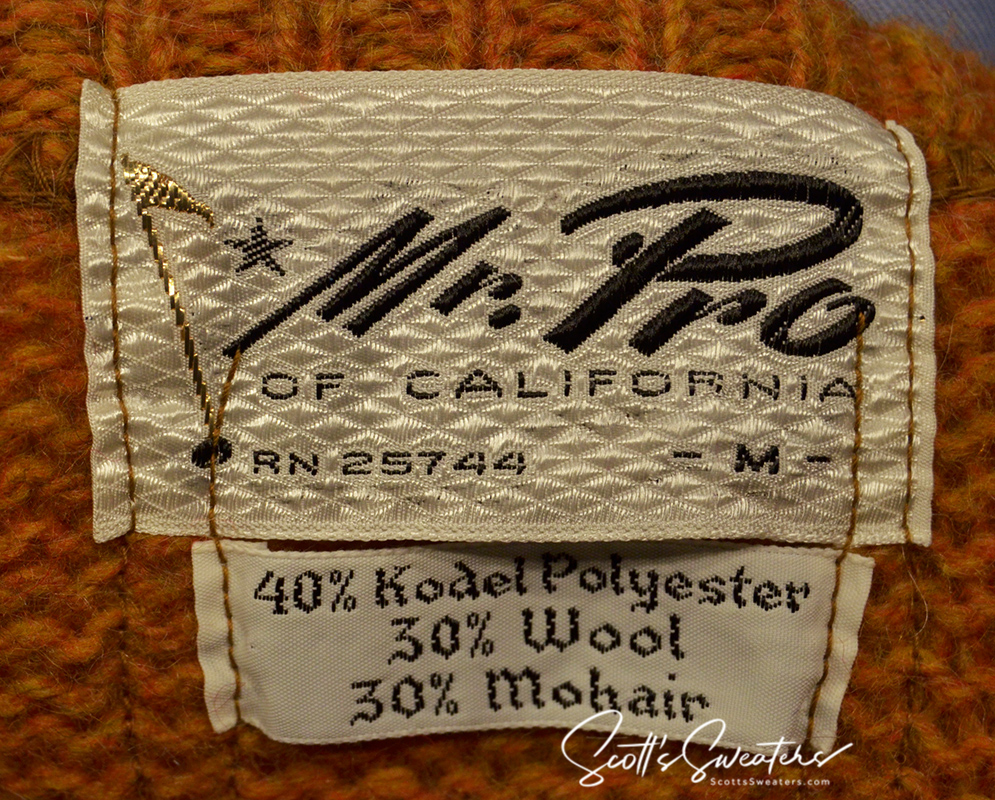 Close-up of a golden retro classic mohair sweater label by Mr. Pro showing fabric composition of 40% Kodel polyester, 30% wool, and 30% mohair.