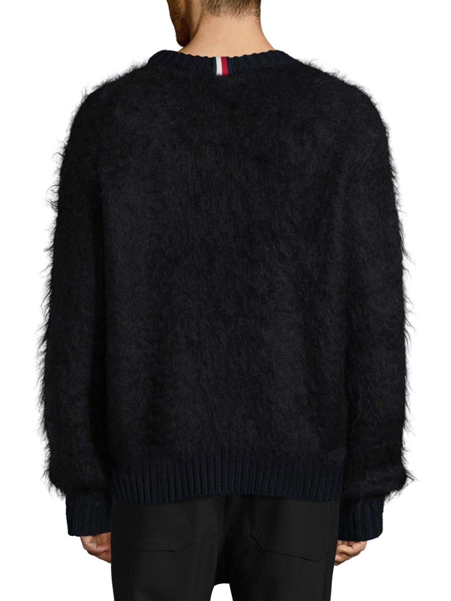 Back view of men's black crewneck Tommy Hilfiger mohair sweater with ribbed cuffs and hem
