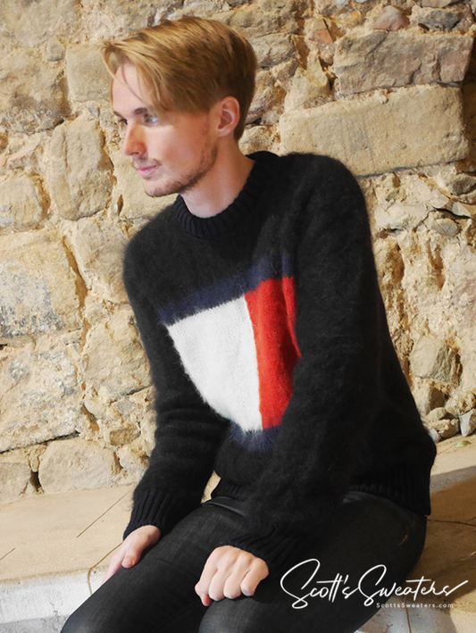Black men's crewneck mohair sweater with large Tommy Hilfiger flag logo on chest worn by model