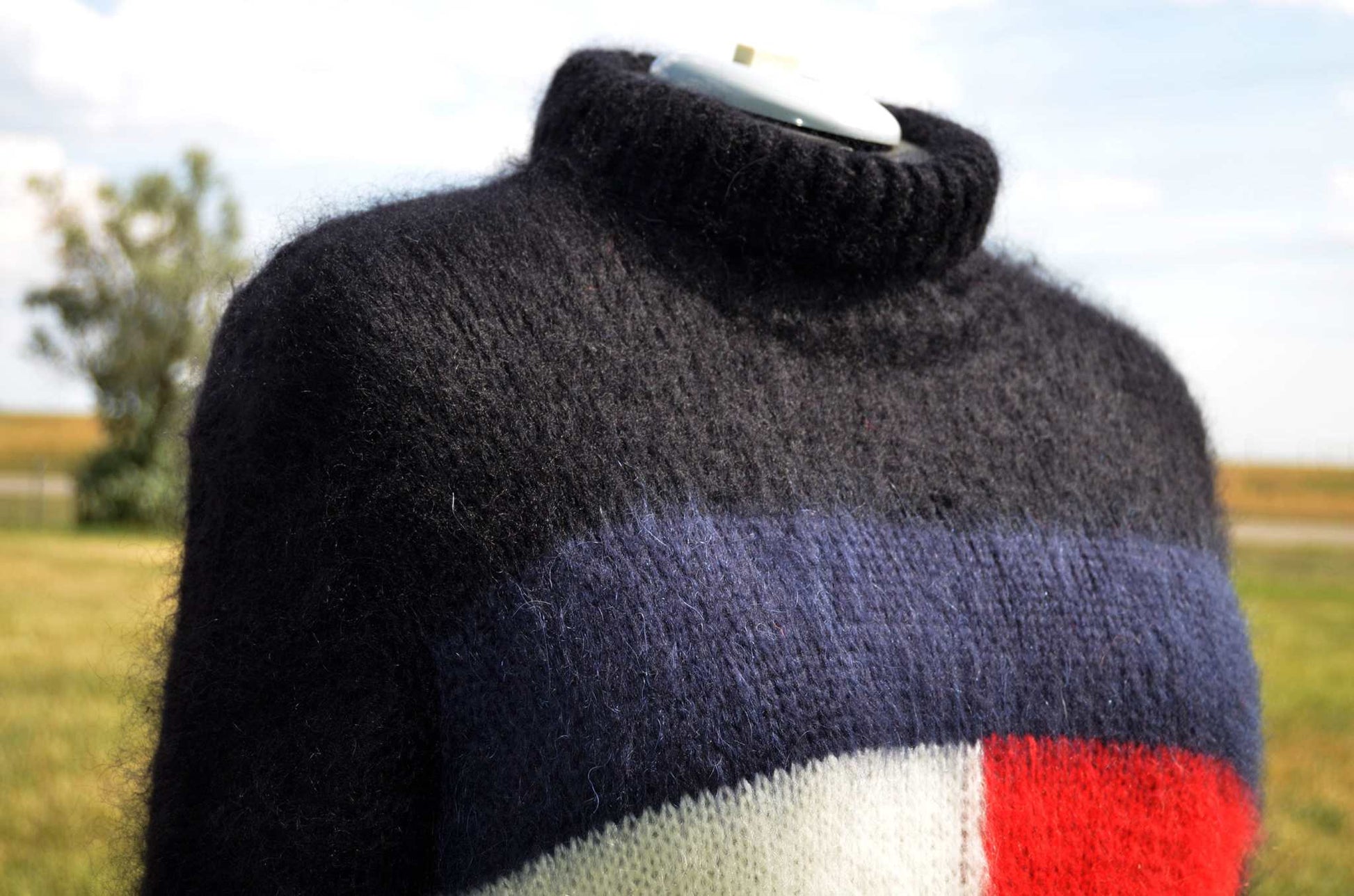 Black fuzzy mohair turtleneck sweaterdress with navy, white, and red Hilfiger logo band in large size
