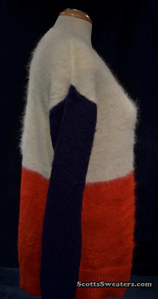 White, red, and navy color-block fuzzy roundneck mohair sweater on mannequin