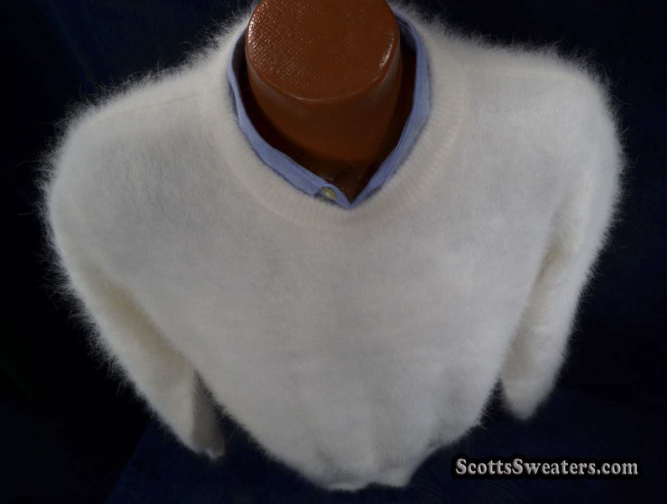 Men's ultra-soft white angora crewneck sweater on mannequin with blue shirt collar