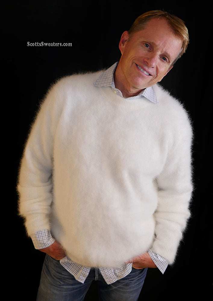 Men's ultra-soft white angora crewneck sweater worn over a checked shirt