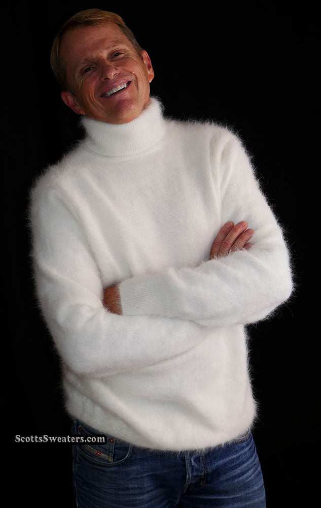 Smiling man wearing a white men's ultra-soft angora turtleneck sweater with folded arms