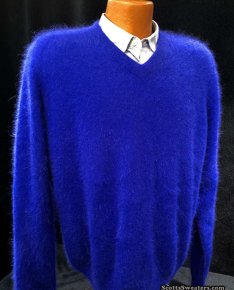Men's ultra-soft angora V-neck sweater in vibrant blue displayed on a mannequin with white shirt underneath