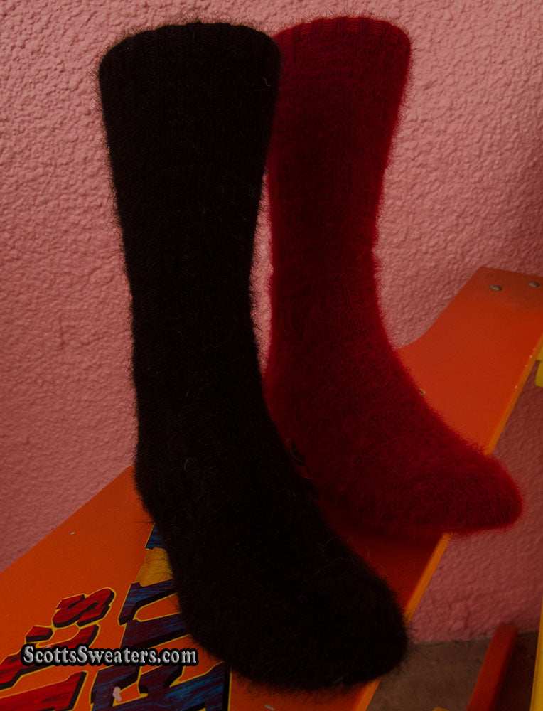 Pair of men's angora dress socks in black and red, made with 70% angora for warmth and comfort.