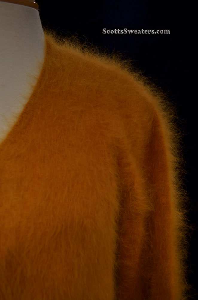 Woman's gold ultra-soft angora cardigan sweater medium size close-up view