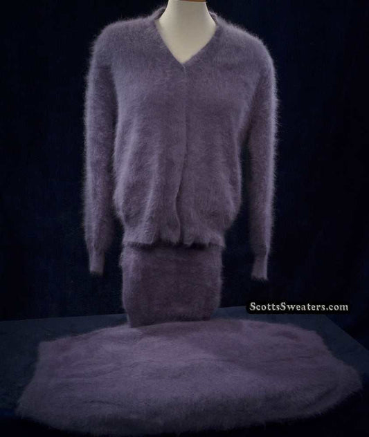 Woman wearing cinereous-grey 3-piece angora cardigan with short and long matching skirts medium size