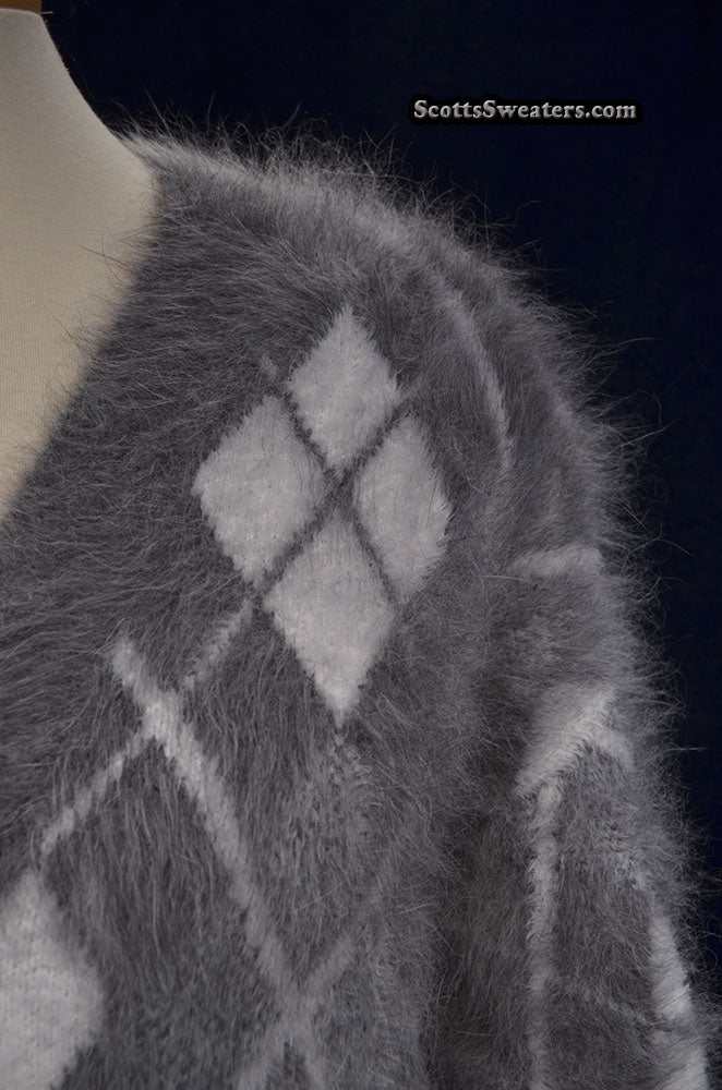 Woman's super-soft grey and white argyle angora cardigan sweater close-up