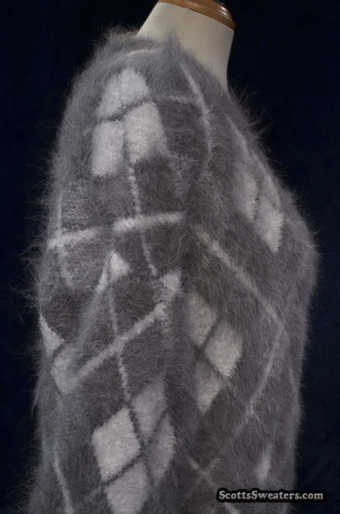 Woman's super-soft grey and white argyle angora cardigan sweater on mannequin