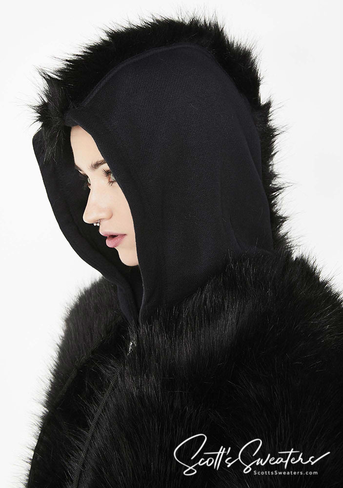 Black punk style thick fluffy faux-fur jacket with mohawk hood and metal D-ring straps on cuffs