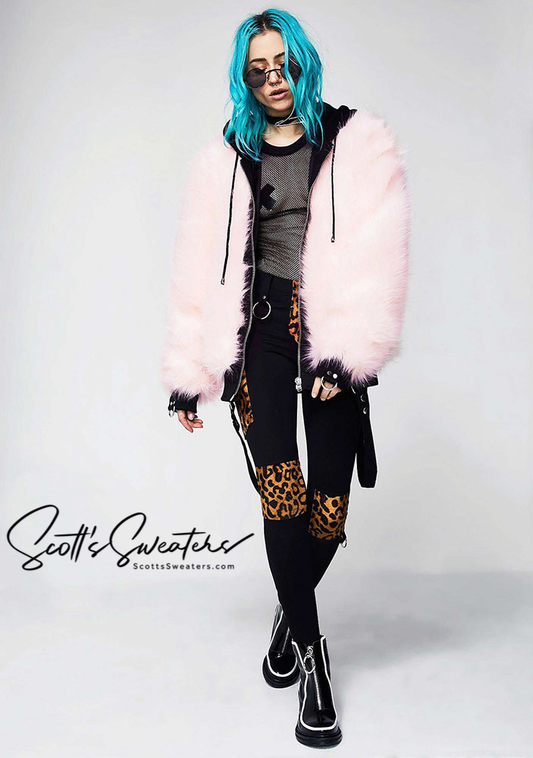 Punk style thick and fluffy pink faux-fur jacket with zipper front, hanging straps, and metal D-rings on cuffs worn by model with blue hair.