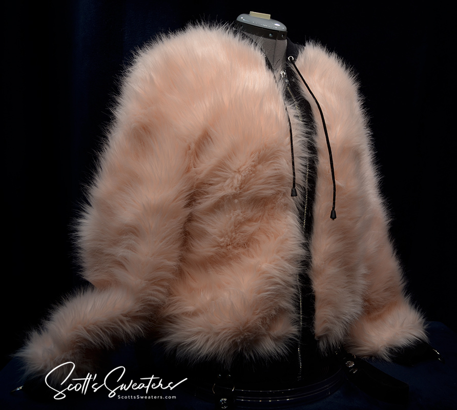 Punk style thick and fluffy blush faux-fur jacket with zipper and hood on mannequin