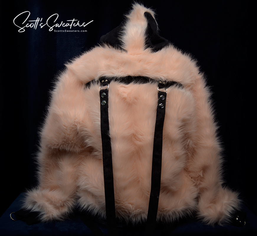 Punk style thick fluffy faux-fur jacket with hood, hanging straps, and metal D-rings on cuffs.
