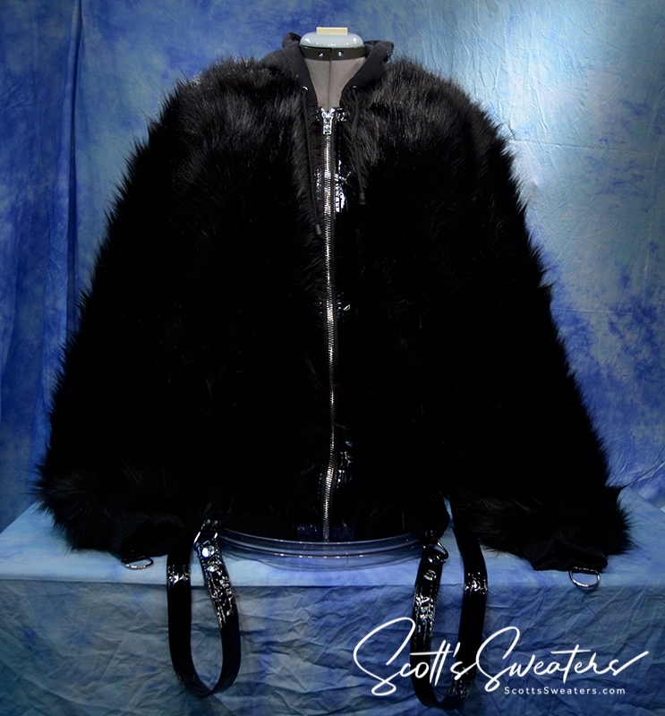 Punk style thick fluffy black faux-fur jacket with zipper front and hanging straps on cuffs