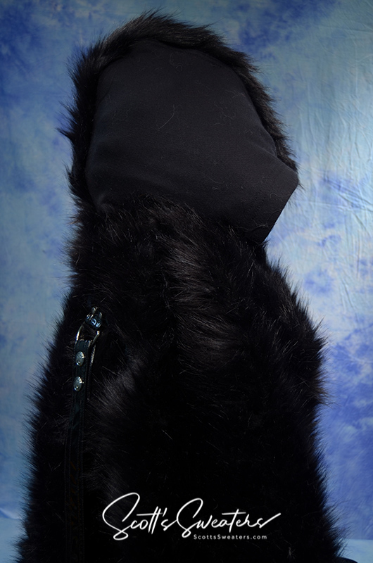 Black punk style thick and fluffy faux-fur jacket with hood and zipper front