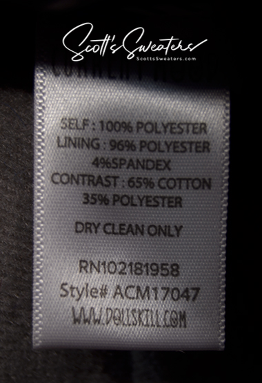 Punk style thick and fluffy faux-fur jacket care label with fabric composition and dry clean instructions