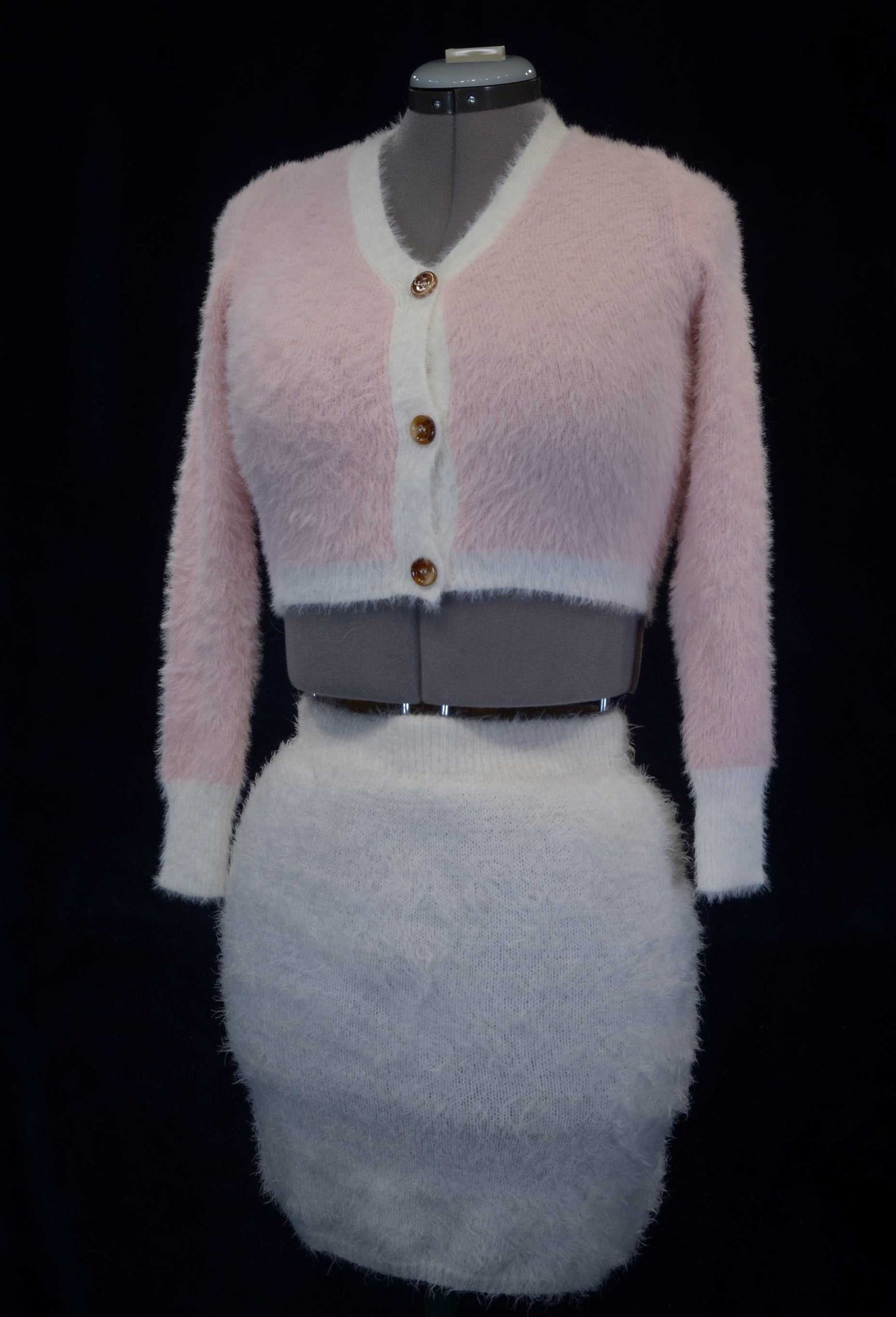 Girl's or woman's soft pink fuzzy plush eyelash cardigan sweater with buttons on mannequin