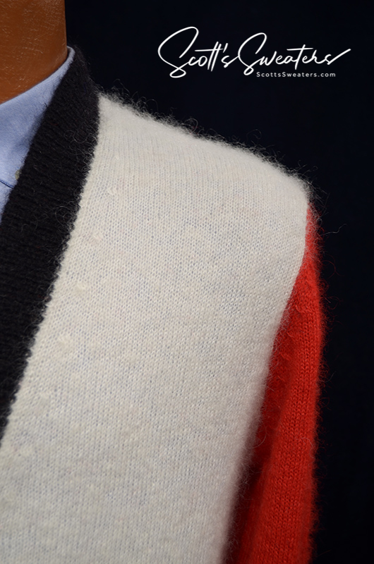 Close-up of WeSC skateboarder street wear unisex mohair cardigan sweater with black, white, and red color blocks