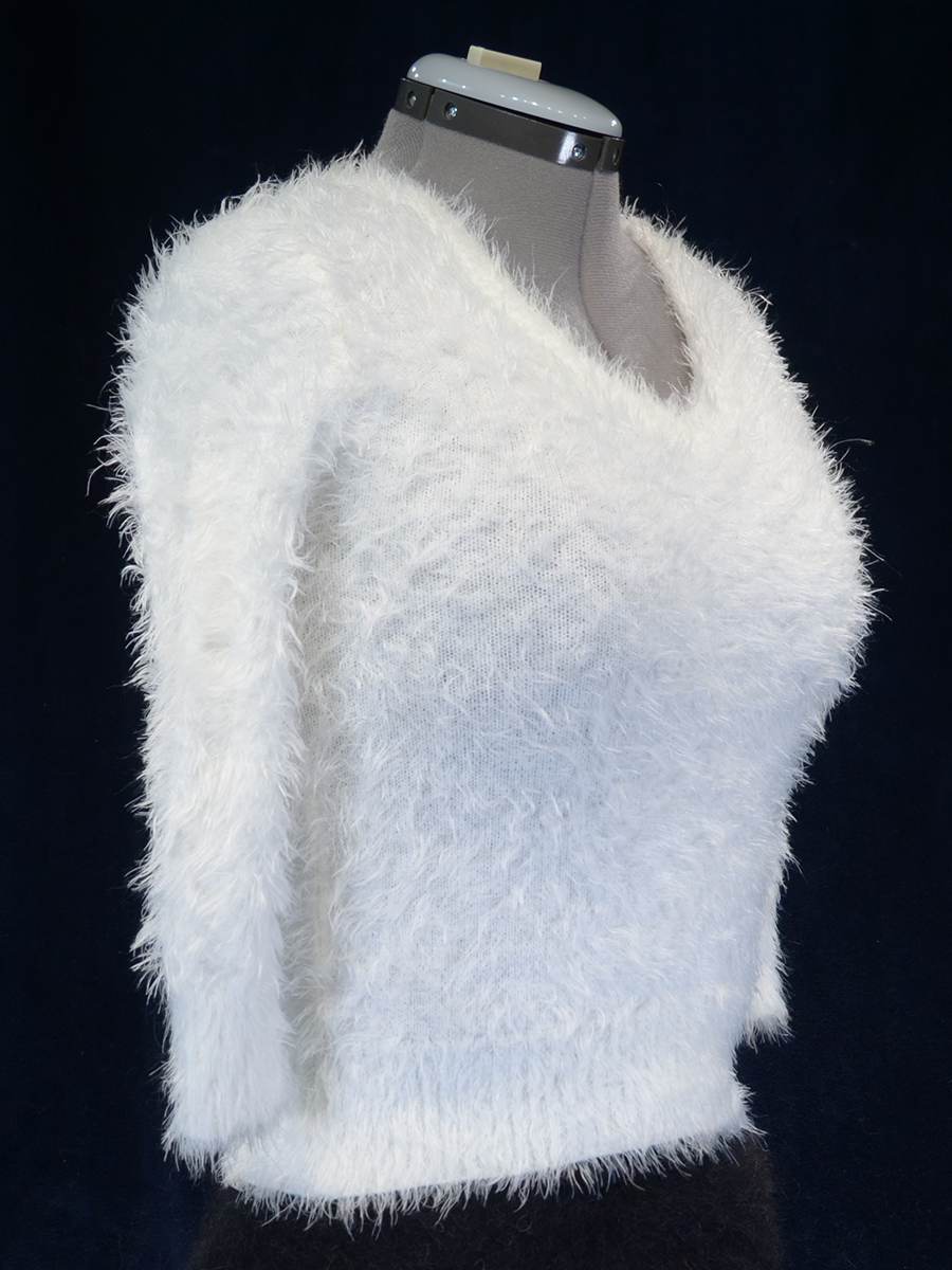 Woman's fuzzy white plush eyelash deep V-neck crop-top sweater with 3/4 sleeves on mannequin