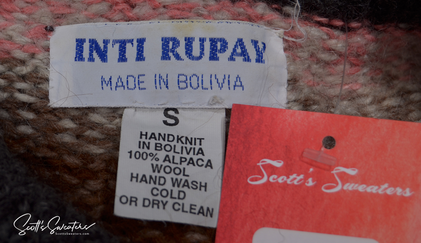Label of a woman’s colorful ultra-soft alpaca cardigan sweater, hand knit in Bolivia, 100% alpaca wool, size small with care instructions and Scott's Sweaters tag.