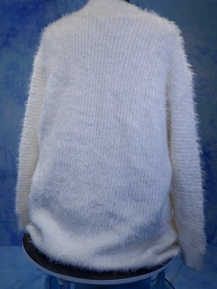 Woman's white eyelash cardigan sweater with black sleeve stripes back view