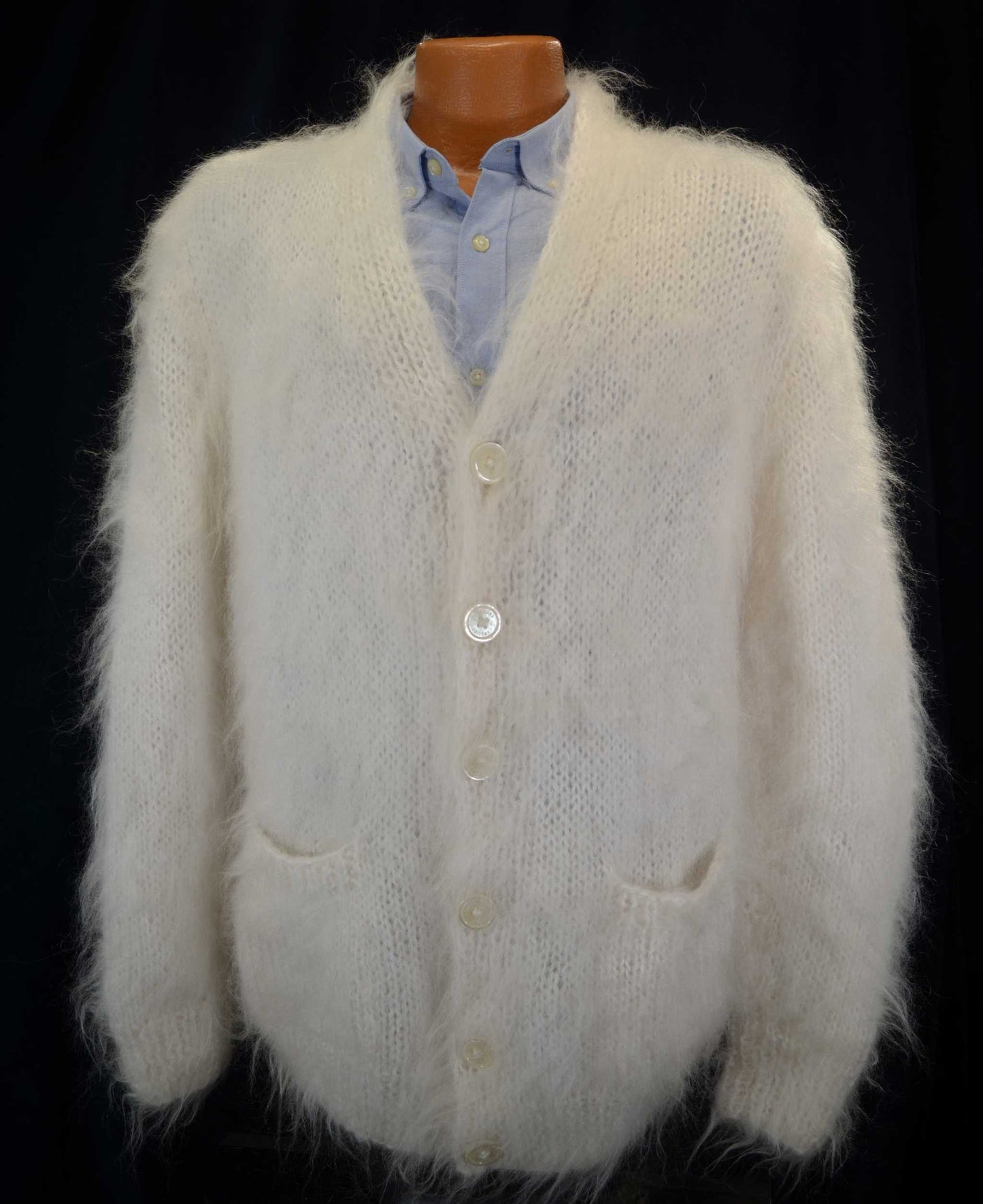 Men's white hand-knit mohair fuzzy cardigan sweater with front pockets on mannequin