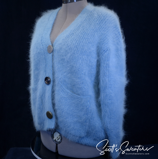 Woman's powder-blue angora cardigan sweater with oversized metal buttons and front pockets in size Large/X-Large