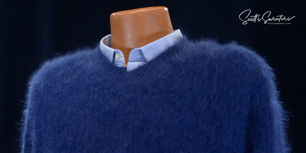 Men's soft luxurious blue angora sweater with a close-cut V-neck and rib-knit design on a mannequin wearing a blue shirt