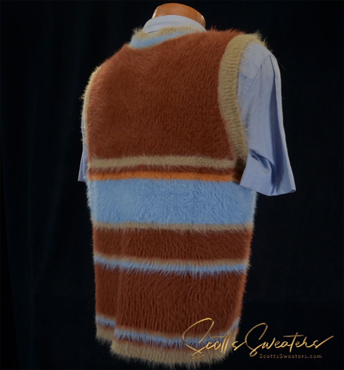 Colorfully striped fuzzy sleeveless sweater vest in brown, blue, and tan on mannequin back view