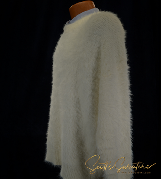 Men's fuzzy ivory crewneck eyelash sweater displayed on mannequin against black background