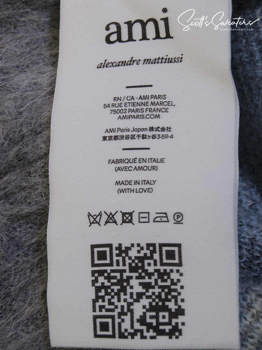 Care label of Men's Alpaca/Mohair Grey Argyle Cardigan Sweater by AMI - Alexandre Mattiussi showing fabric details and care instructions