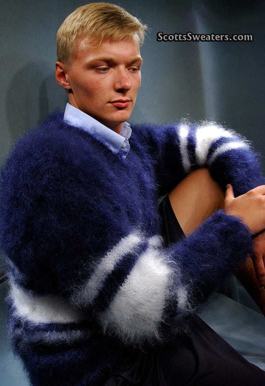 Man wearing extra soft navy blue and white striped Men's Kid Mohair Sweater sitting with arms crossed