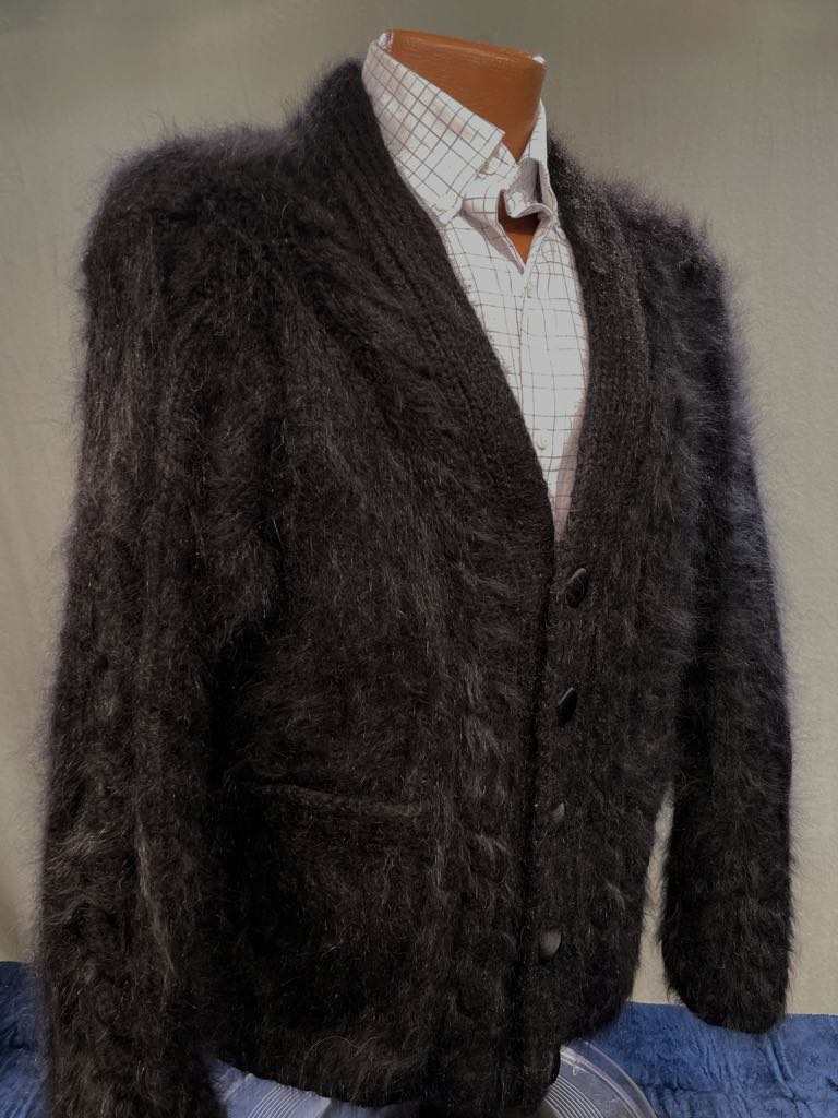 Men's home-spun angora-silk black hand-knit sweater with a soft, fluffy texture modeled on a mannequin.