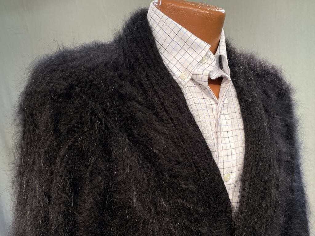 Men's black hand-spun angora-silk sweater with soft brushed fibers, styled over a white checkered shirt