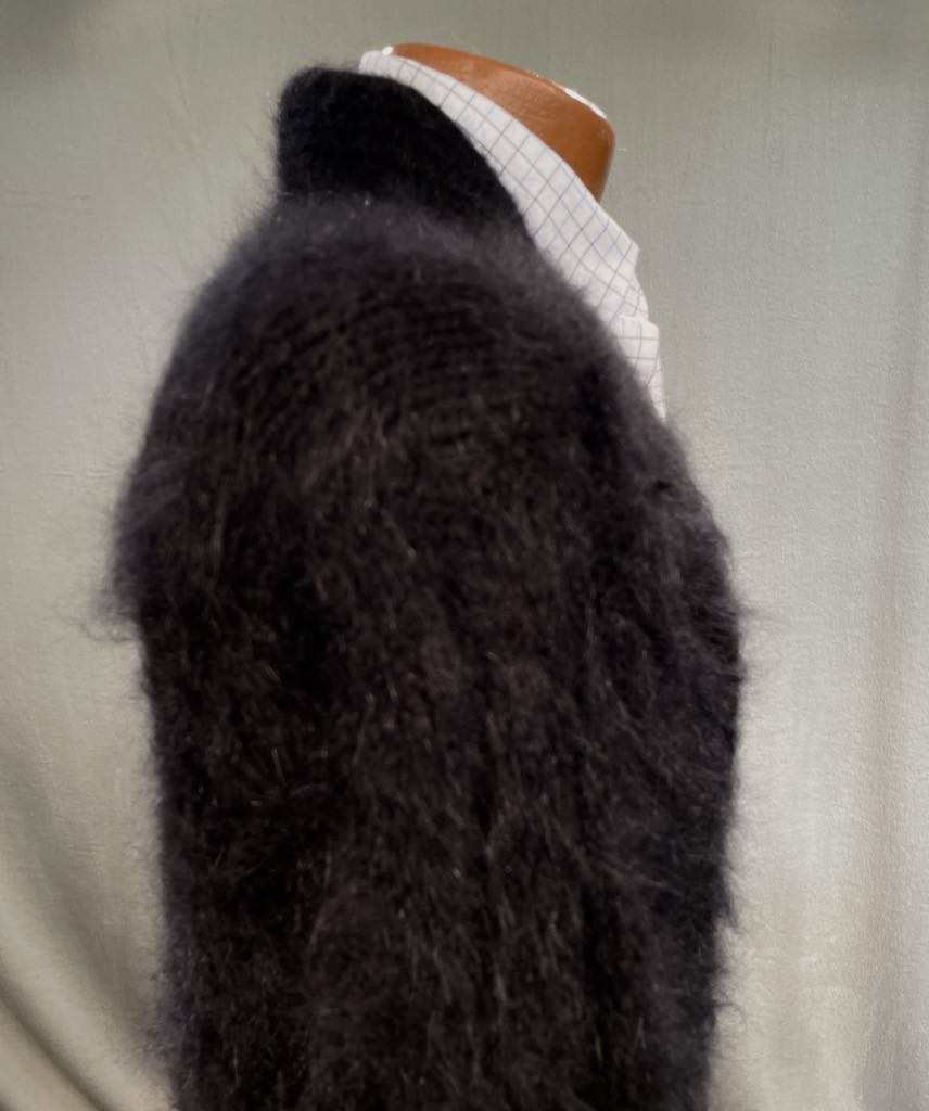 Men's home-spun angora-silk black fuzzy sweater on mannequin with white checkered shirt collar
