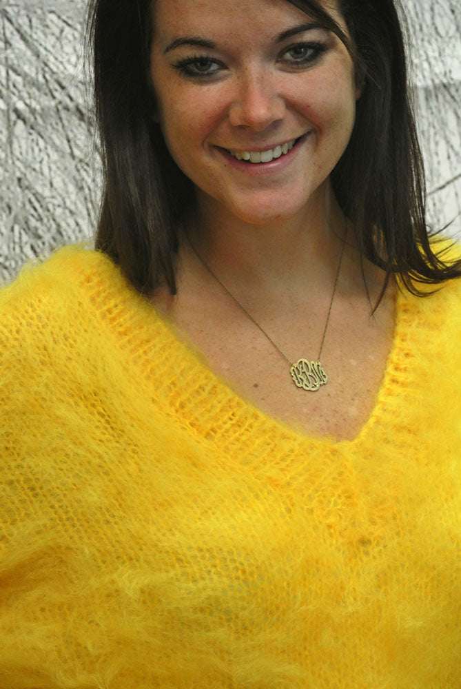 Woman wearing fuzzy yellow mohair double V-neck sweater by Scott's Sweaters