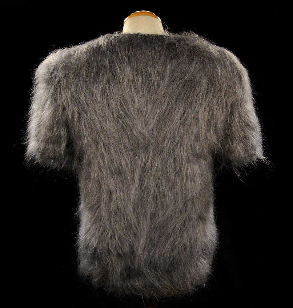 Woman's hand-knit fuzzy gray mohair short-sleeve sweater on mannequin