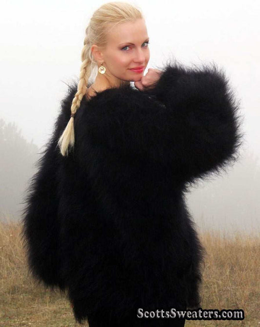 Woman wearing large black very fuzzy mohair sweater with round neck outdoors