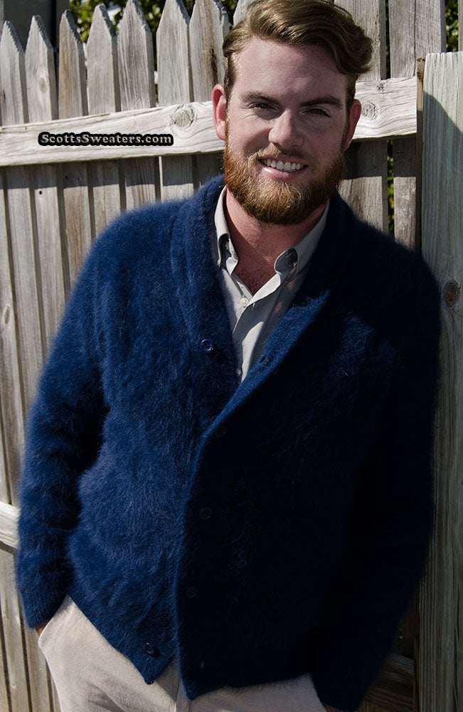 Man wearing a royal blue men's solid-color angora shawl-neck cardigan sweater outdoors