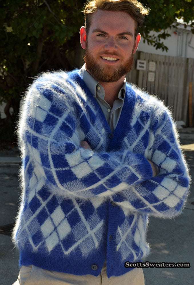 Men's blue and white argyle angora cardigan sweater worn by man outdoors
