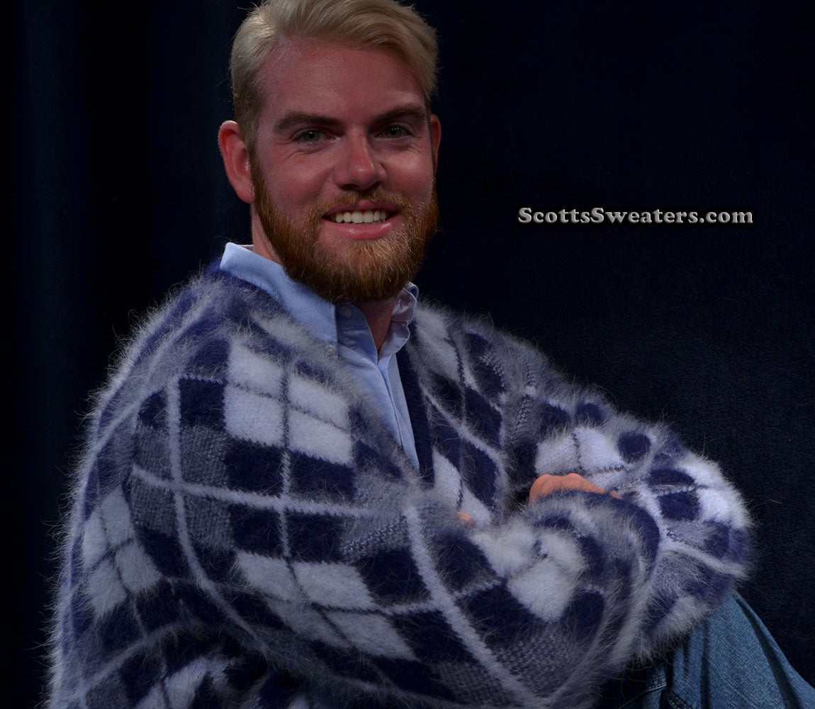 Man wearing a luxurious men's argyle angora cardigan sweater with a soft, fuzzy texture in navy and white tones.